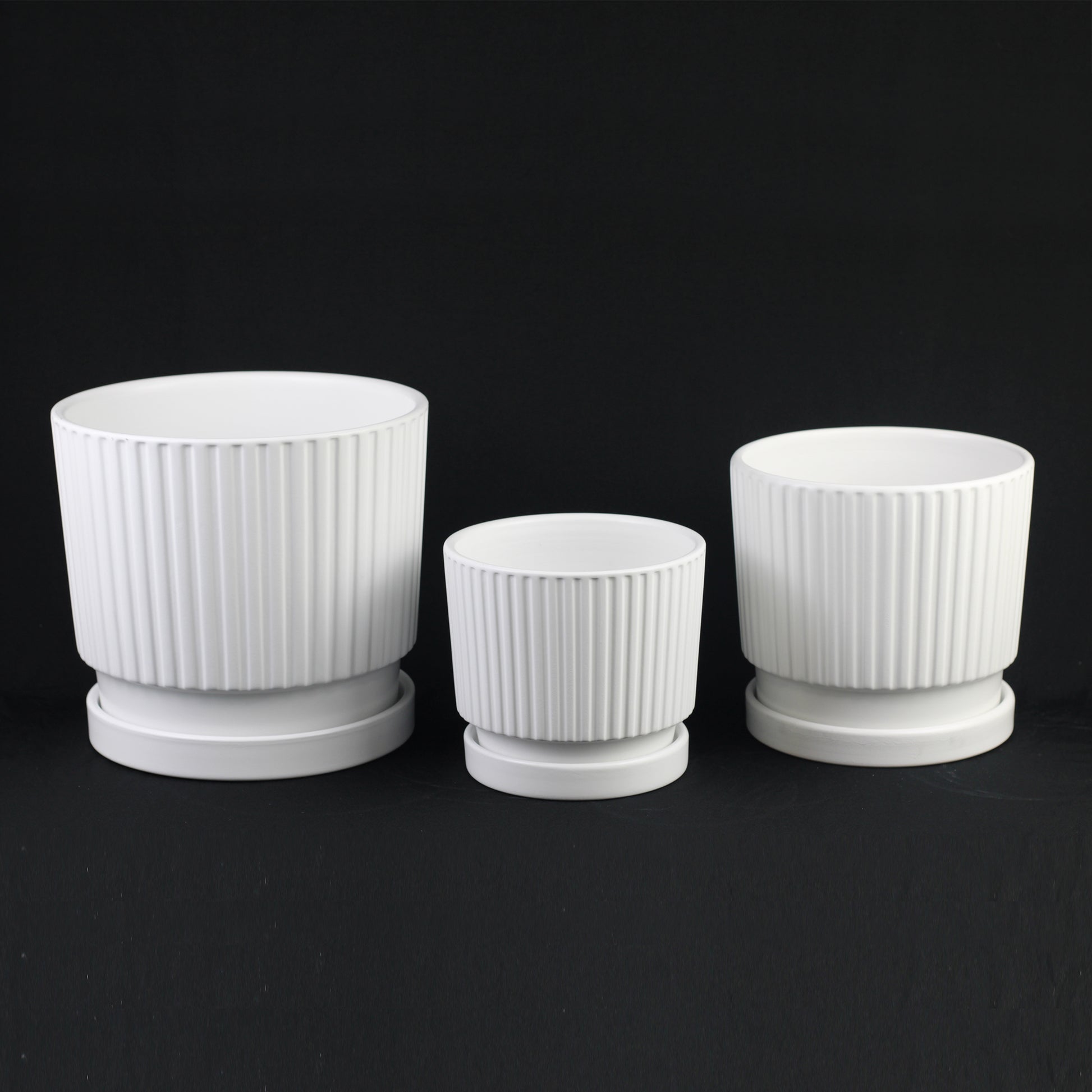 3-Piece White Ceramic Planter Pot Set with Vertical Ribbed Design & Saucers